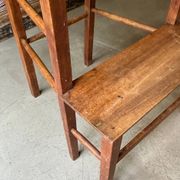High chair made of wood and straw.