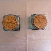 2 glass jars with crusted cork stopper