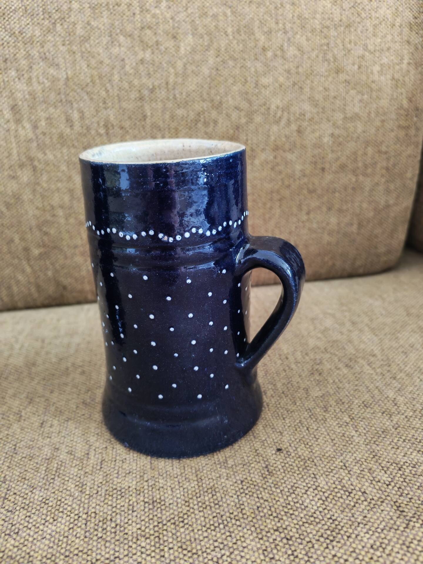 Two vintage mugs in traditional German earthenware.
