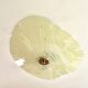 Pale yellow asymmetrical suspension cup 1960