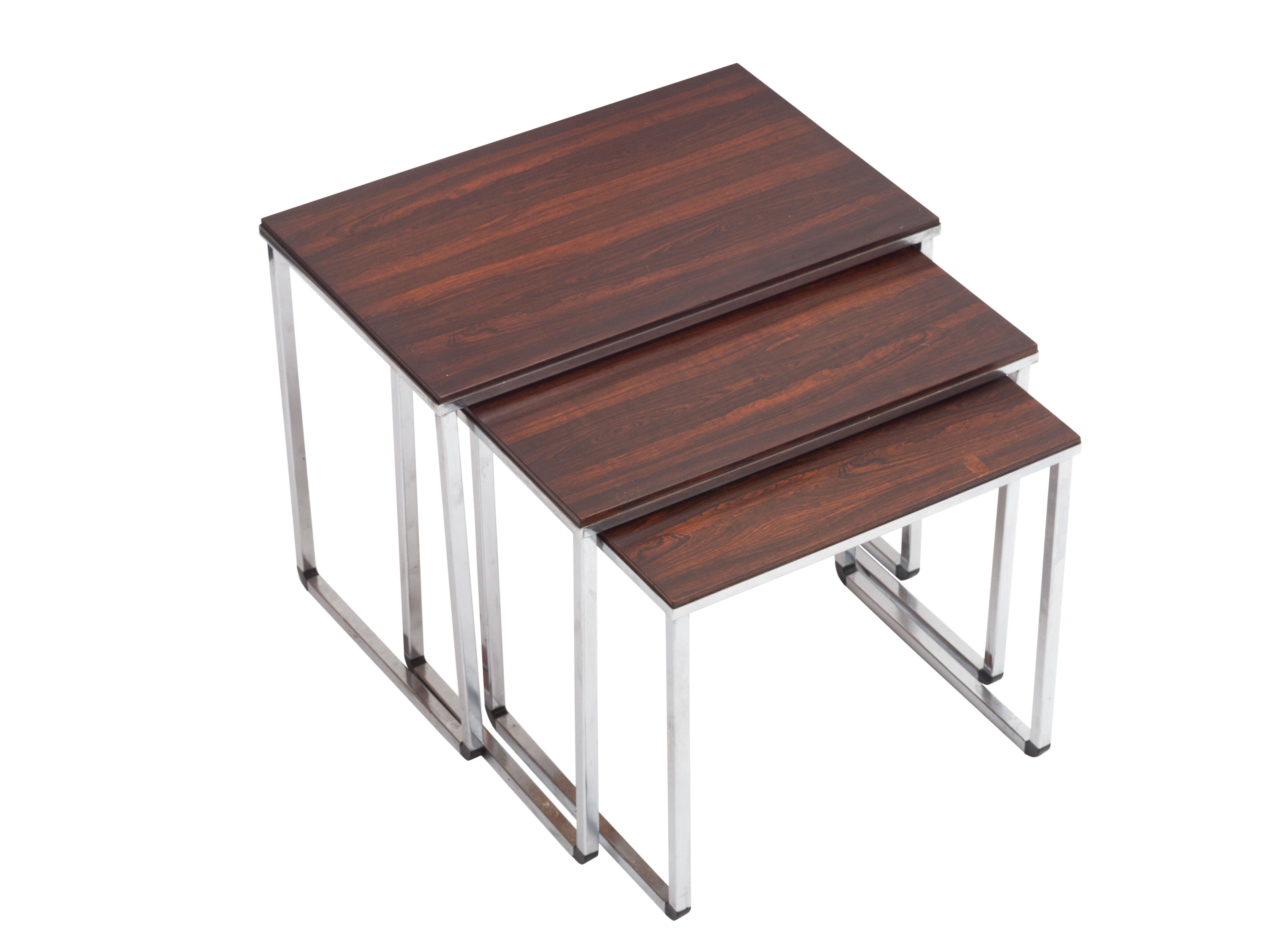 Vintage nesting table in rosewood and high polished metal base.