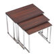 Vintage nesting table in rosewood and high polished metal base.