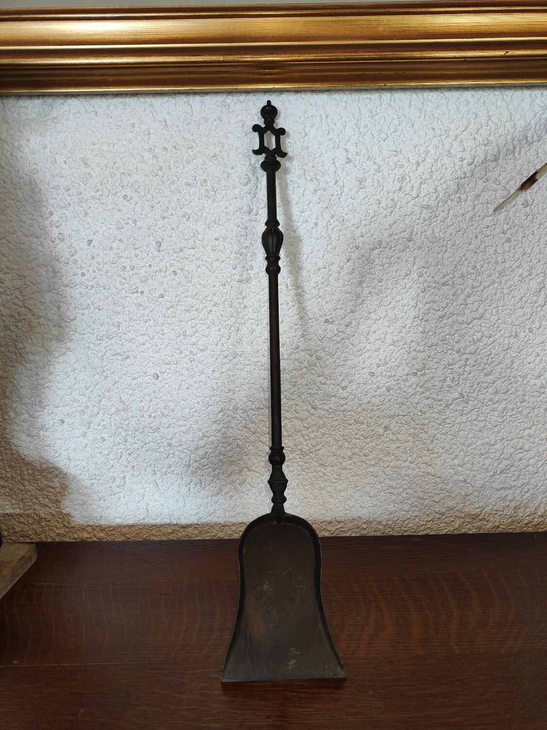 Cast iron carved fireplace shovel