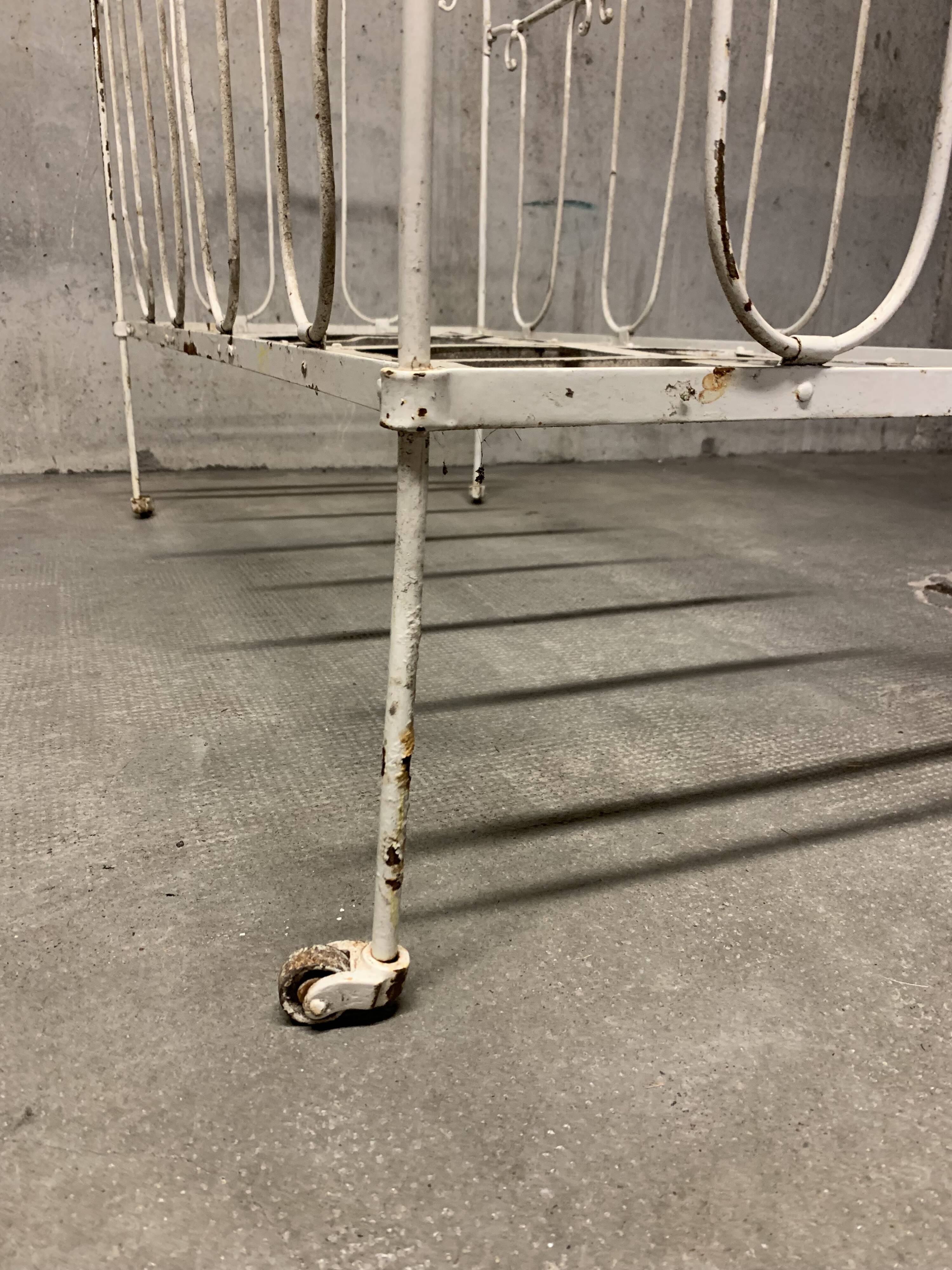 Old vintage wrought iron bench bed