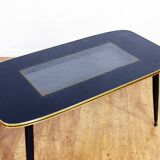 Low table with compass feet with decorative cabinet