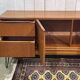 1970s English enfilade in teak with splayed legs.