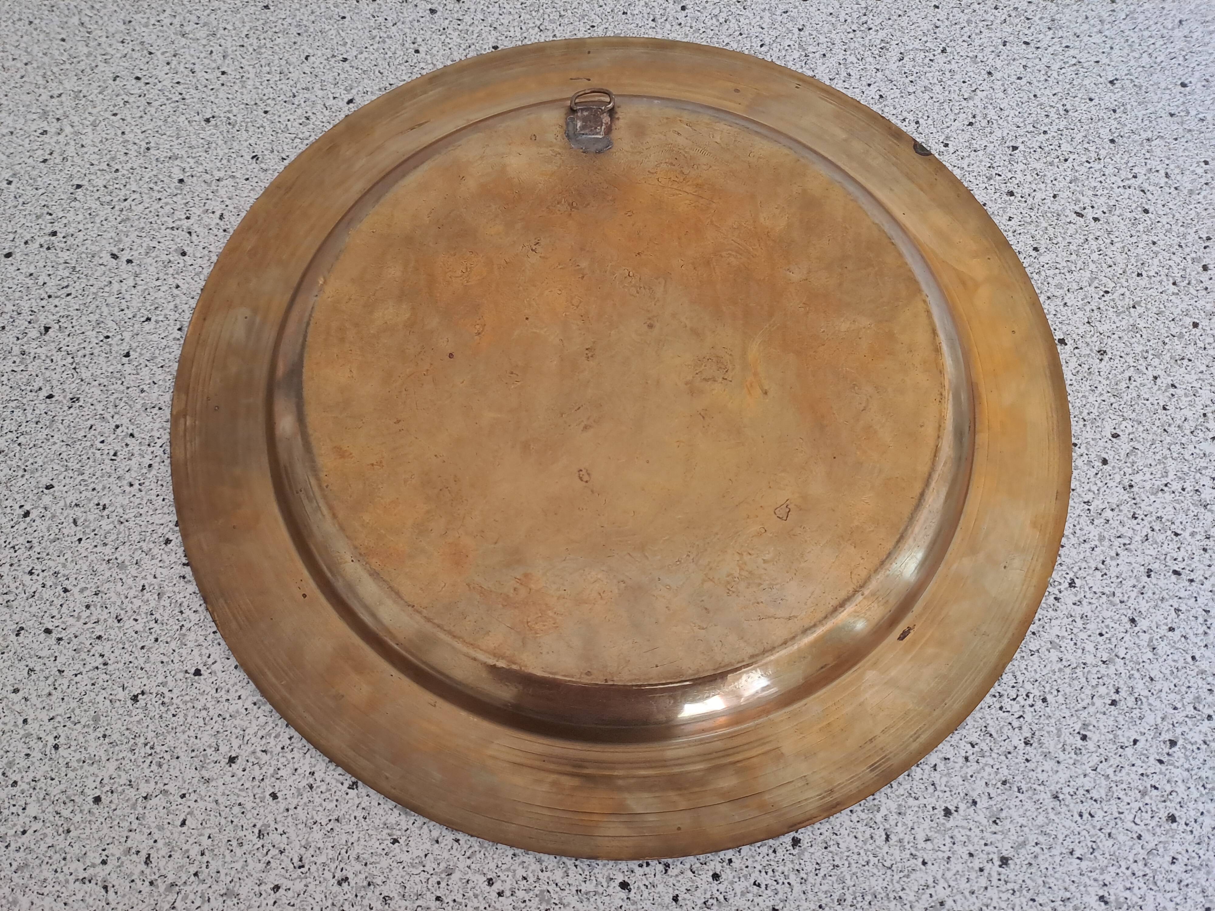 Large chiseled metal plate