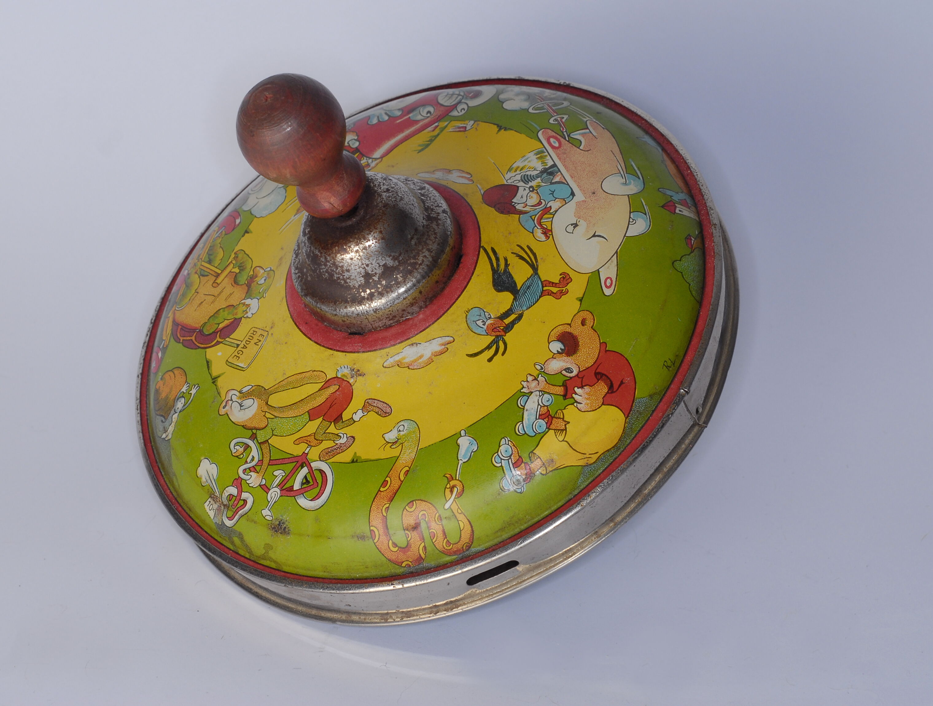 Old lithographed spinning top dating from the 1930