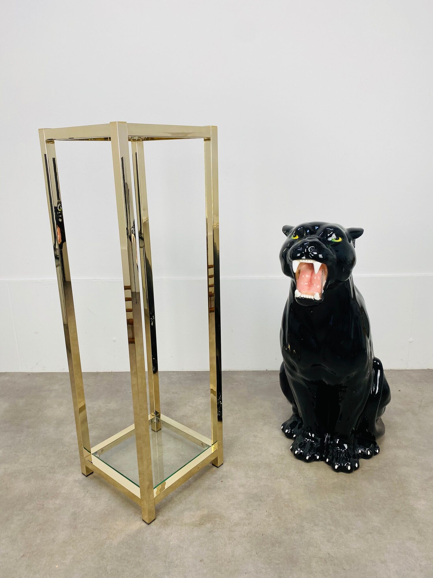 Gilded metal fifth wheel column and Hollywood Regency style glass 70s