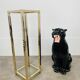Gilded metal fifth wheel column and Hollywood Regency style glass 70s