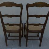 2 stylish solid wood chairs with high backs and straw seats