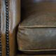 Sheepskin wing chair + XXL patinated footrest