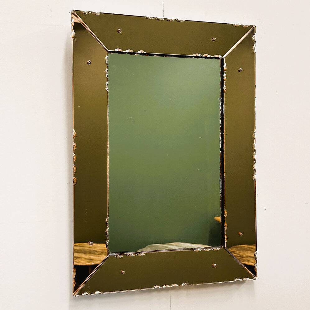 Striking French amber-coloured mirror with sculpted edge details, 1940s