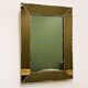 Striking French amber-coloured mirror with sculpted edge details, 1940s