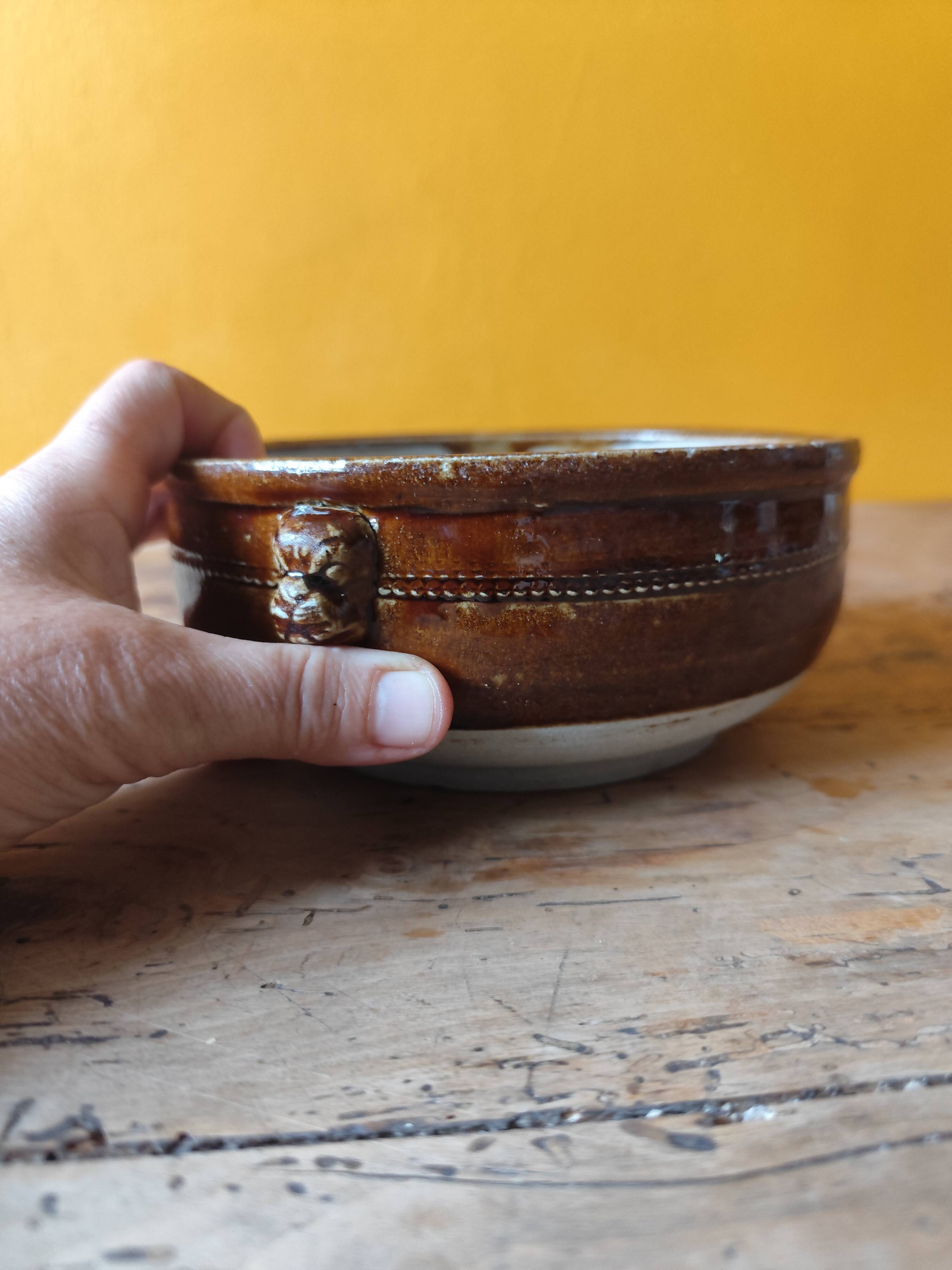 Old small glazed ceramic dish with lion head decoration - brown enamel kitchen bowl