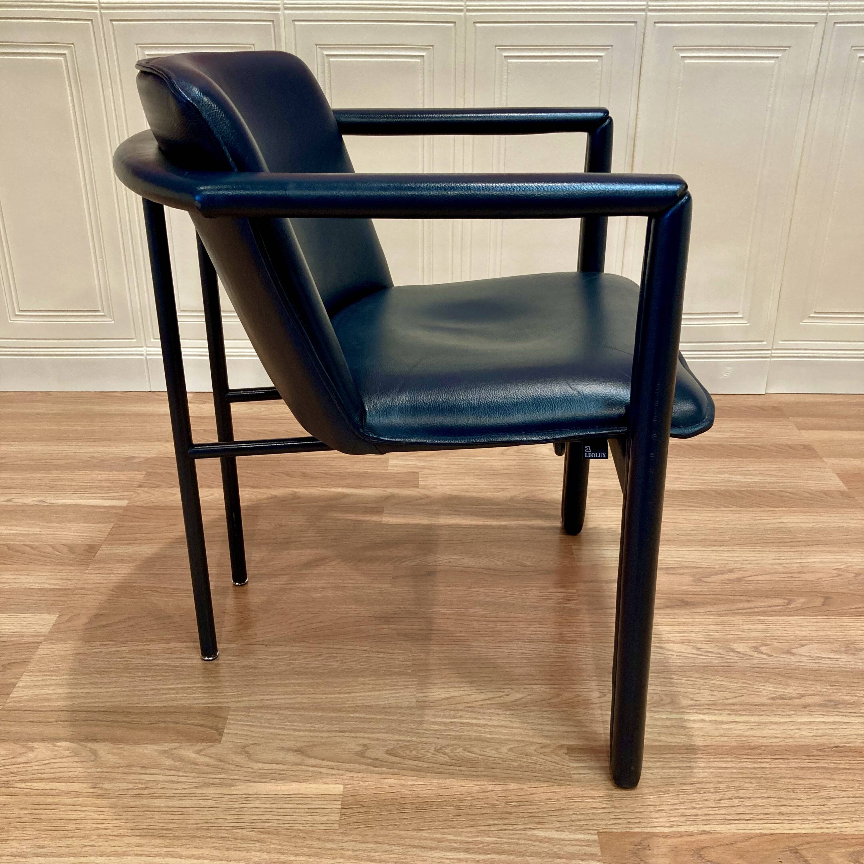Set of 3 designer leather and metal armchairs.