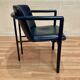 Set of 3 designer leather and metal armchairs.