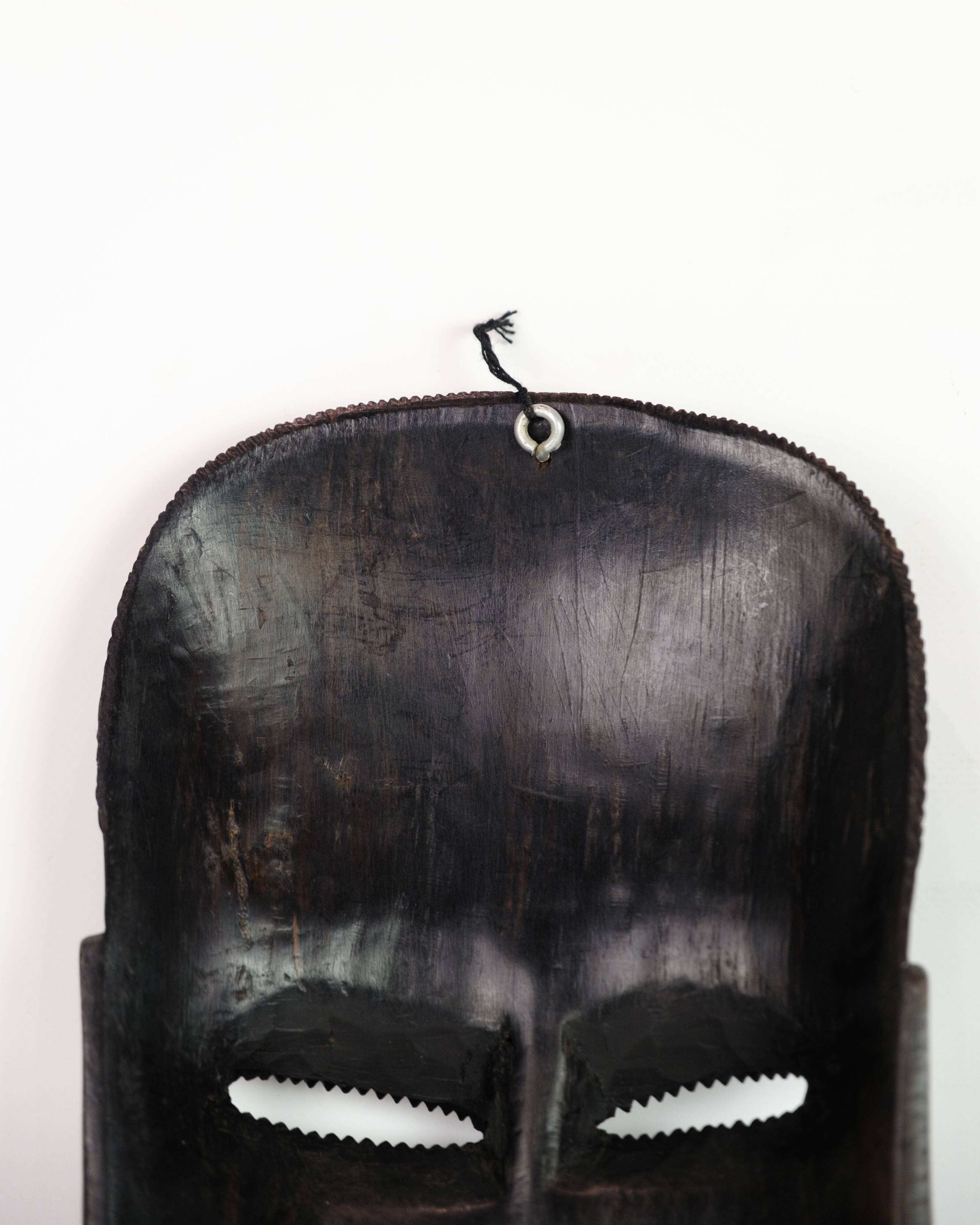 African Mask Hand Craved In Dark Wood From West Africa