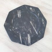 Decorative plate made of fossilised orthoceras marble.
