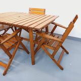 Vintage garden furniture set consisting of a table with extensions and 4 armchairs
