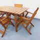 Salon de jardin vintage composé d’une table avec rallonges et 4 fauteuils