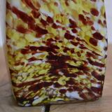 Yellow and white speckled decanter