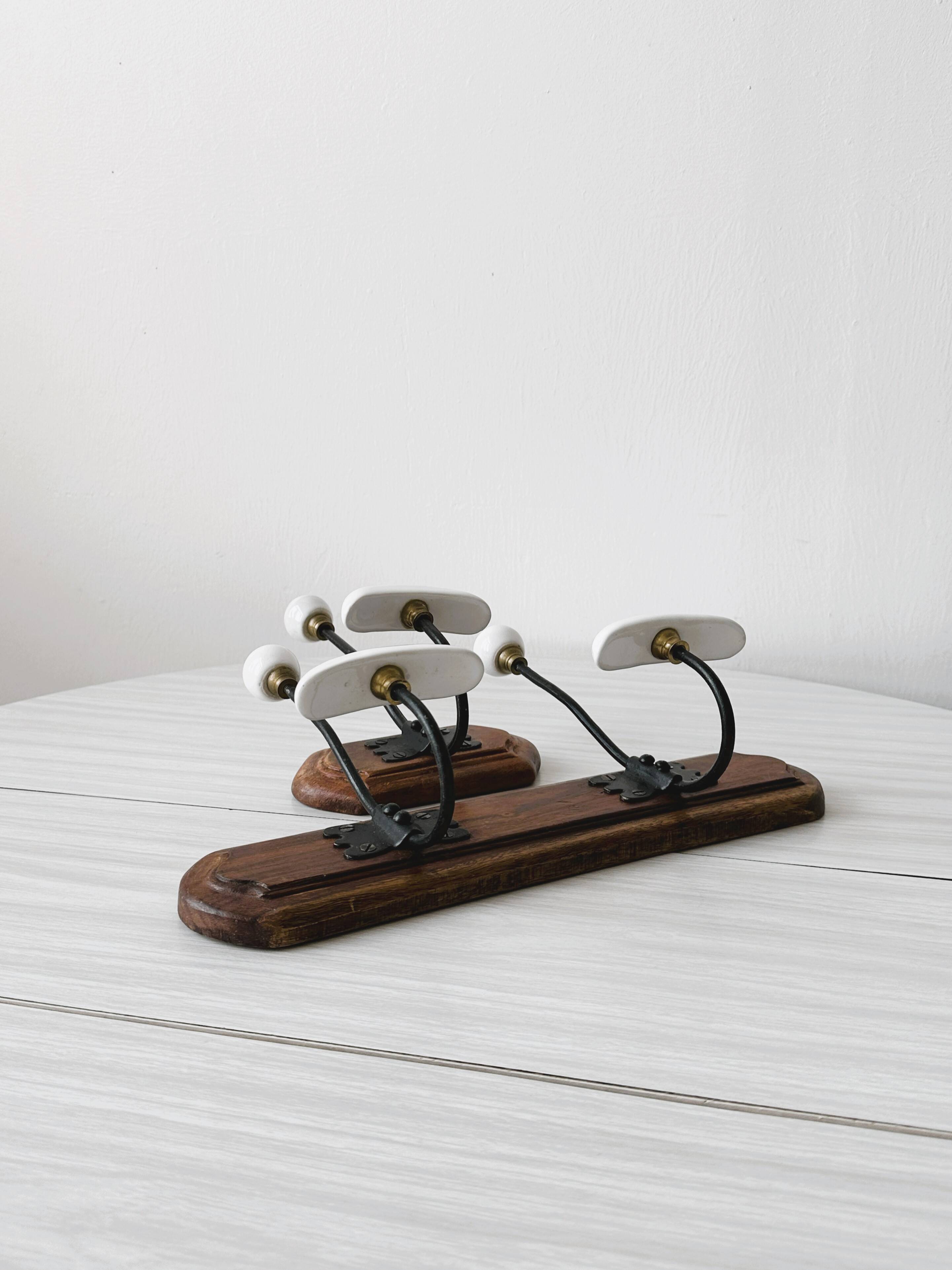Set of two wooden and porcelain coat hooks