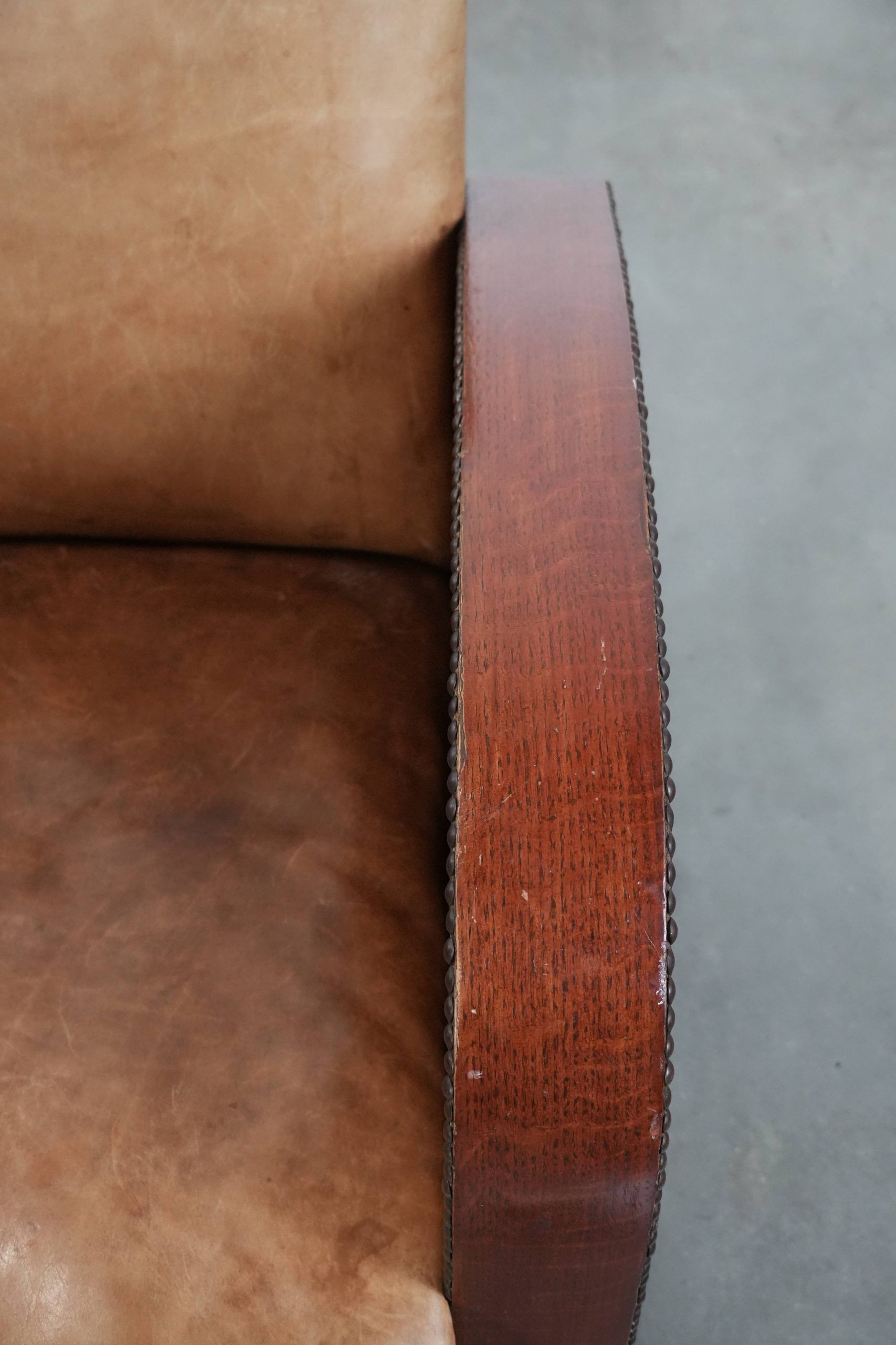 Art Deco design armchair made of cowhide leather in light cognac colour