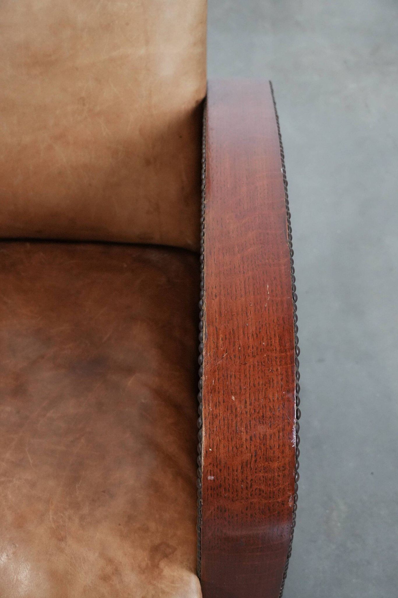 Art Deco design armchair in light cognac cowhide leather.