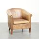 Vintage cowhide club armchair in English style in a light colour scheme