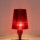 Red plastic Kartell table lamp - model Take - design by Ferruccio Laviani