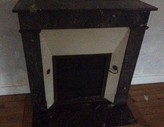 White veined black marble fireplace