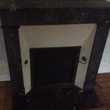 White veined black marble fireplace