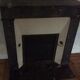 White veined black marble fireplace
