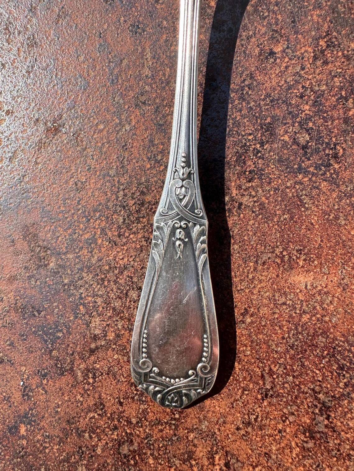 Strawberry spoon or antique Art Nouveau fruit salad in silver metal.