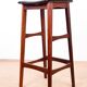 4 Danish high stools, rosewood and black leather, Knud Bent for Dyrlund.