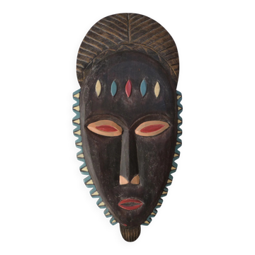 Carved and painted wooden wall mask