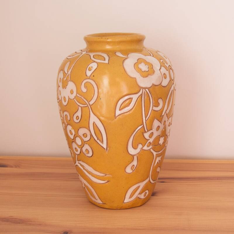 Yellow enamel vase with white flower decoration