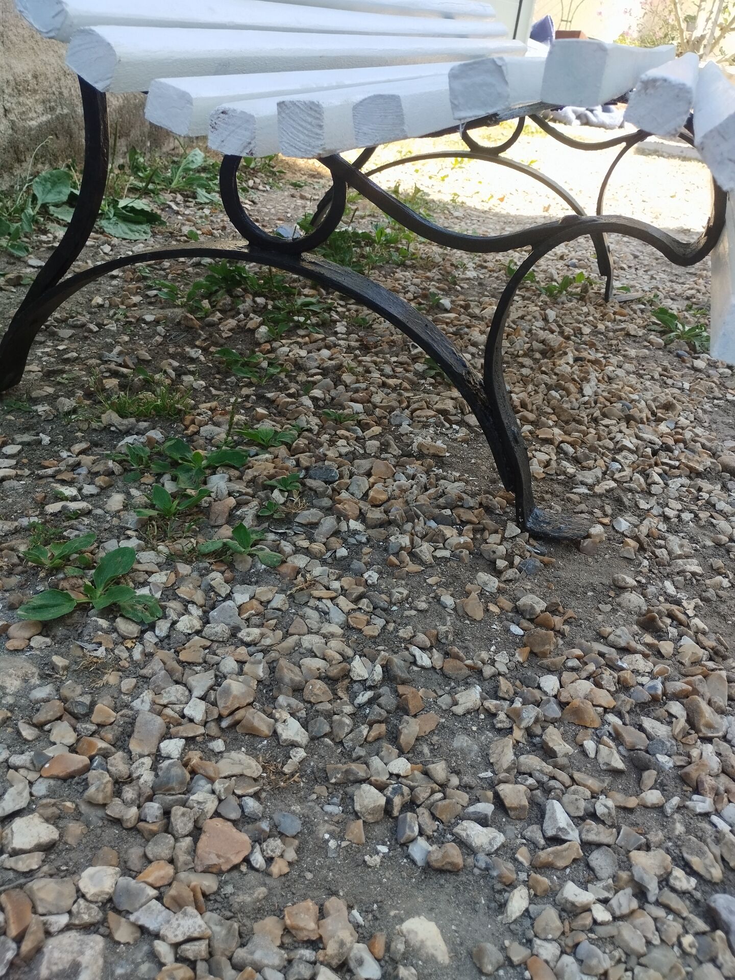 Antique garden bench with cast iron legs