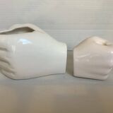 Duo of candle holder and empty pocket in the shape of a hand