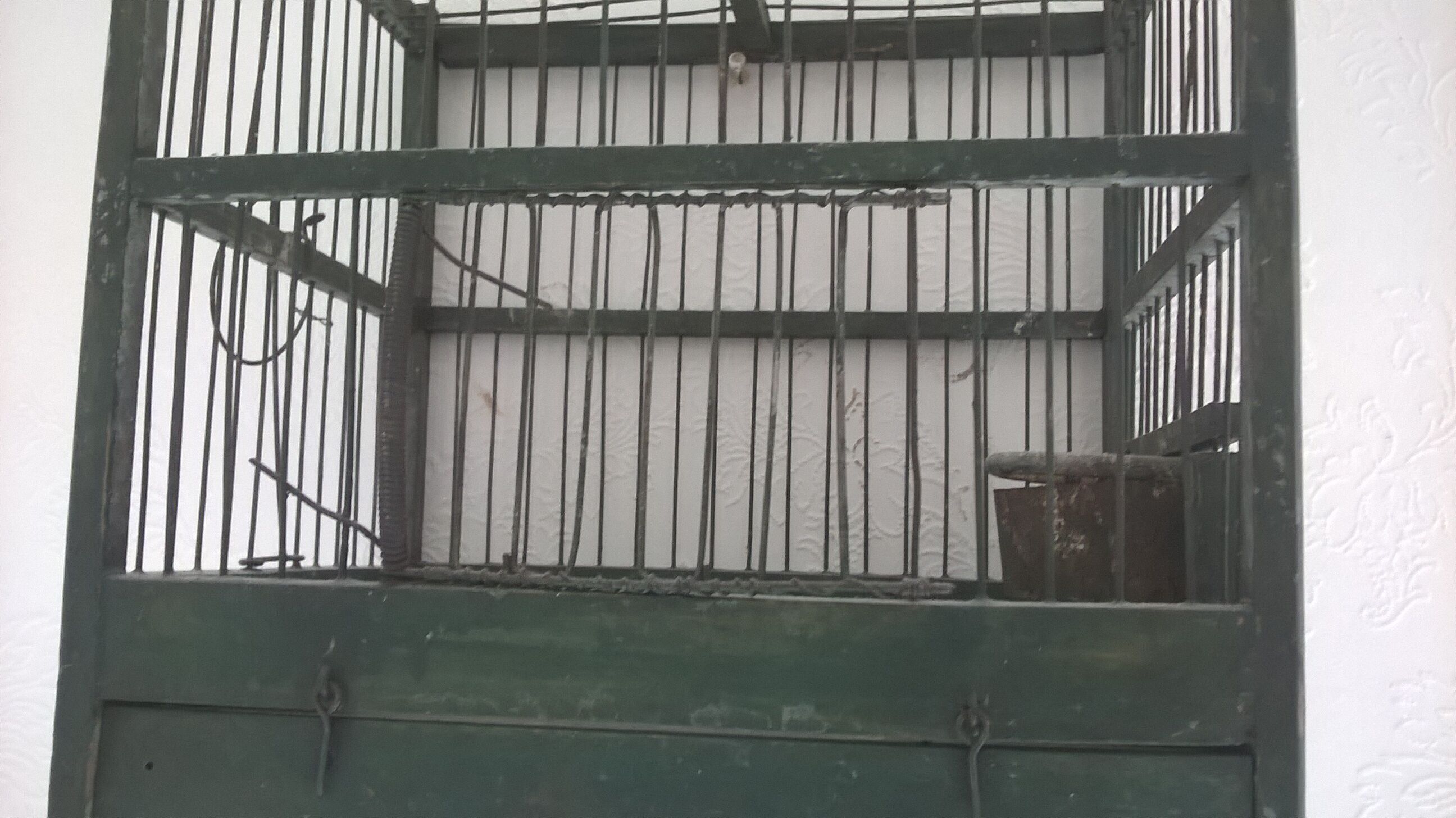 Wooden bird cage with feeder