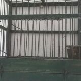 Wooden bird cage with feeder