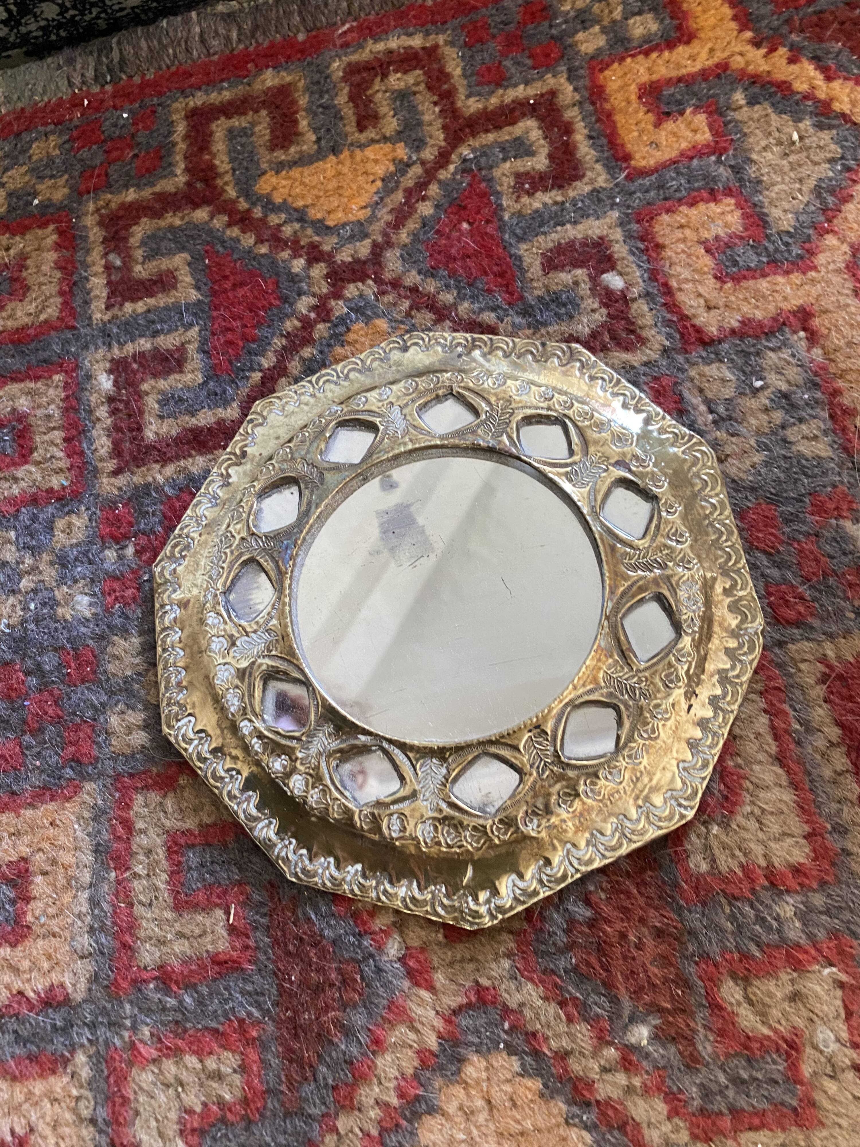 Antique mirror in worked brass