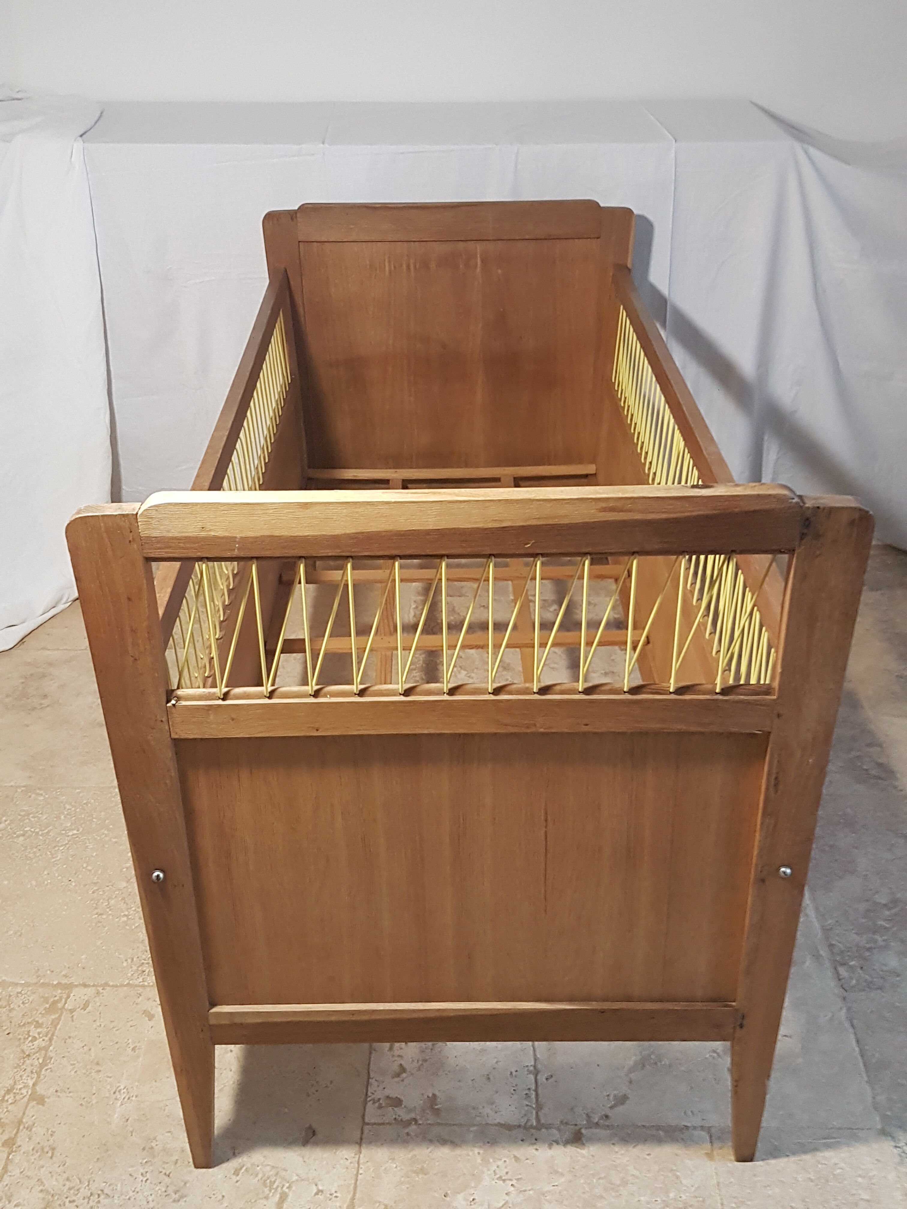 Children's bed made of wood and yellow scoubidou, 1950s.