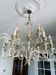Candle chandelier in wrought iron with flowers
