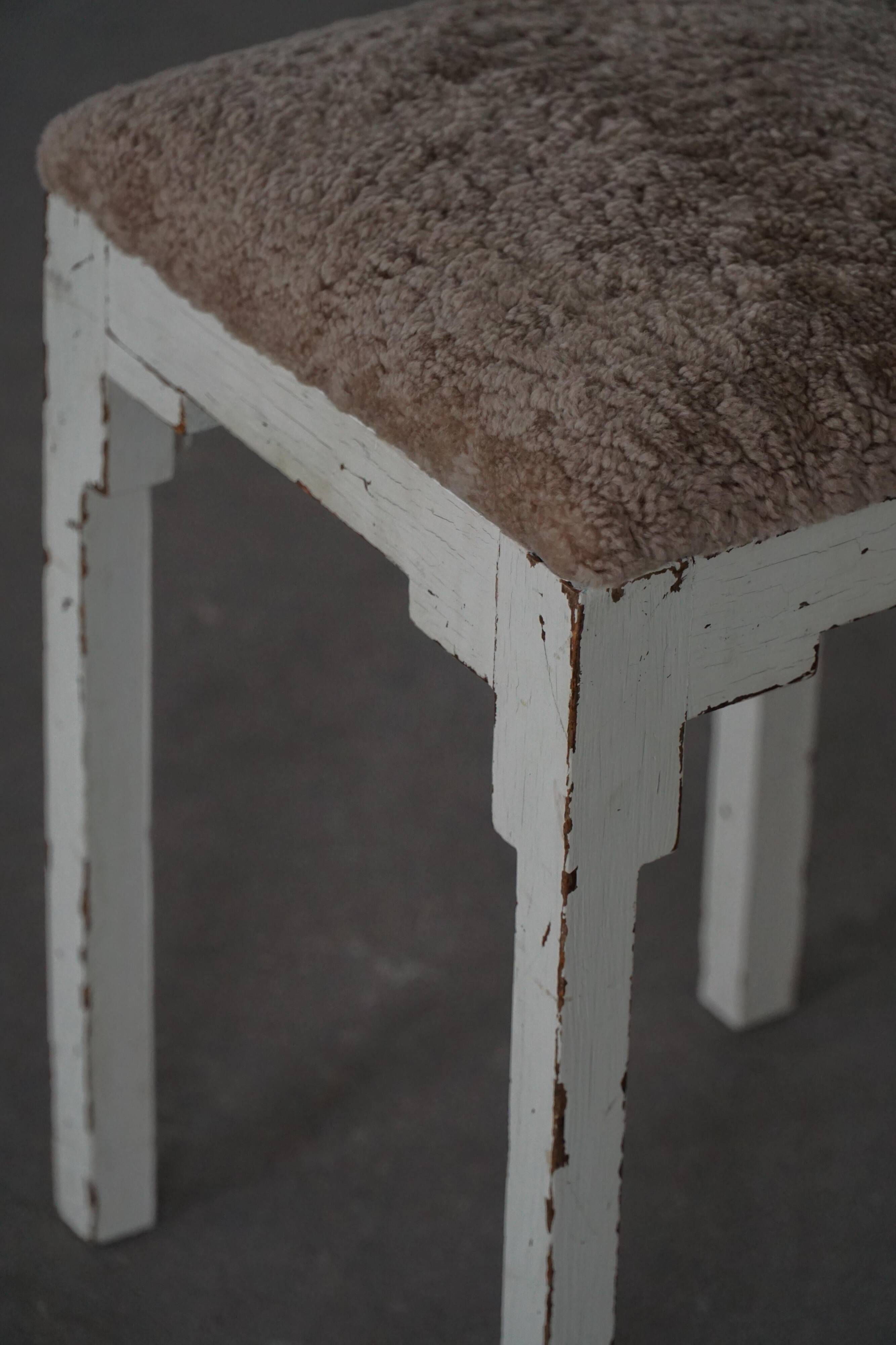 A pair of antique Danish stools, seats in lambswool, late 19th century.