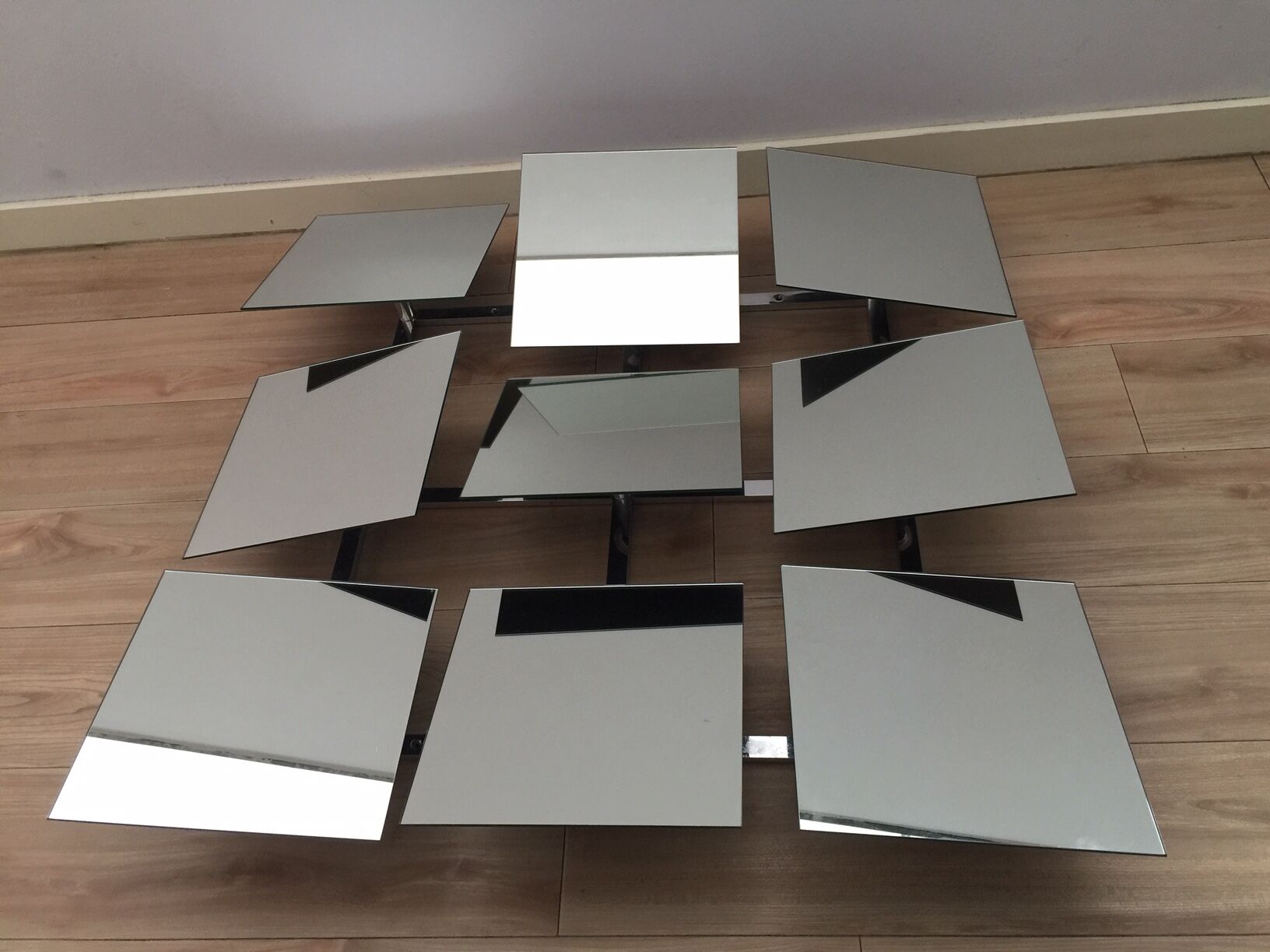 Scandinavian mirror has 9 removable panels by Markus Borgen