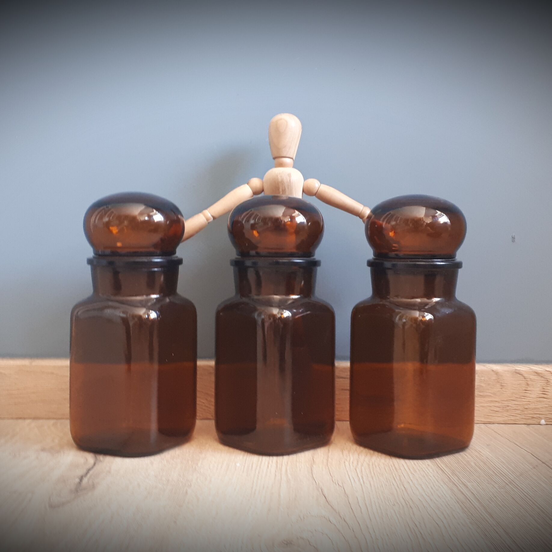 Trio round brown apothecary bottles