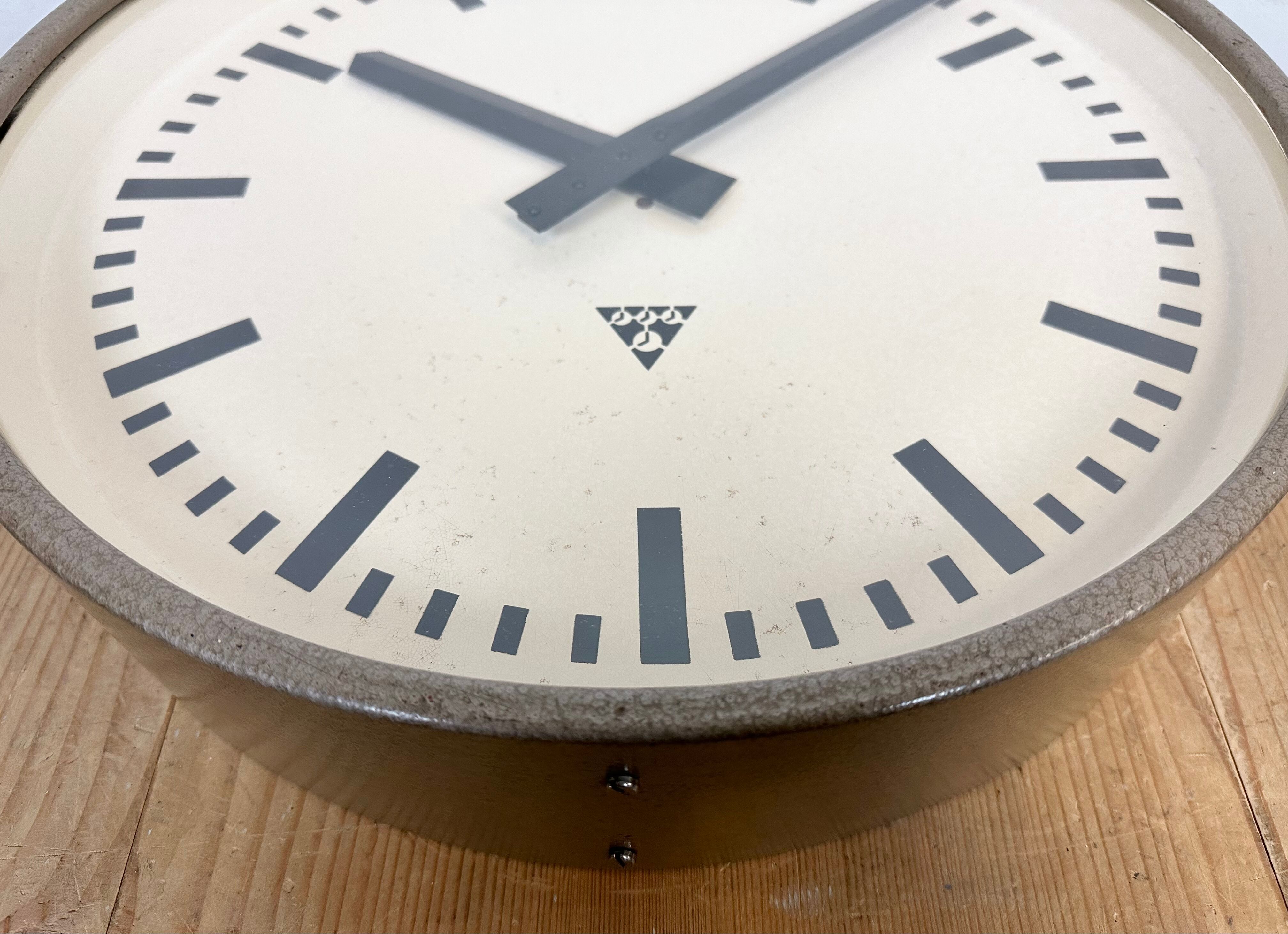 Brown industrial factory wall clock from Pragotron, 1960s