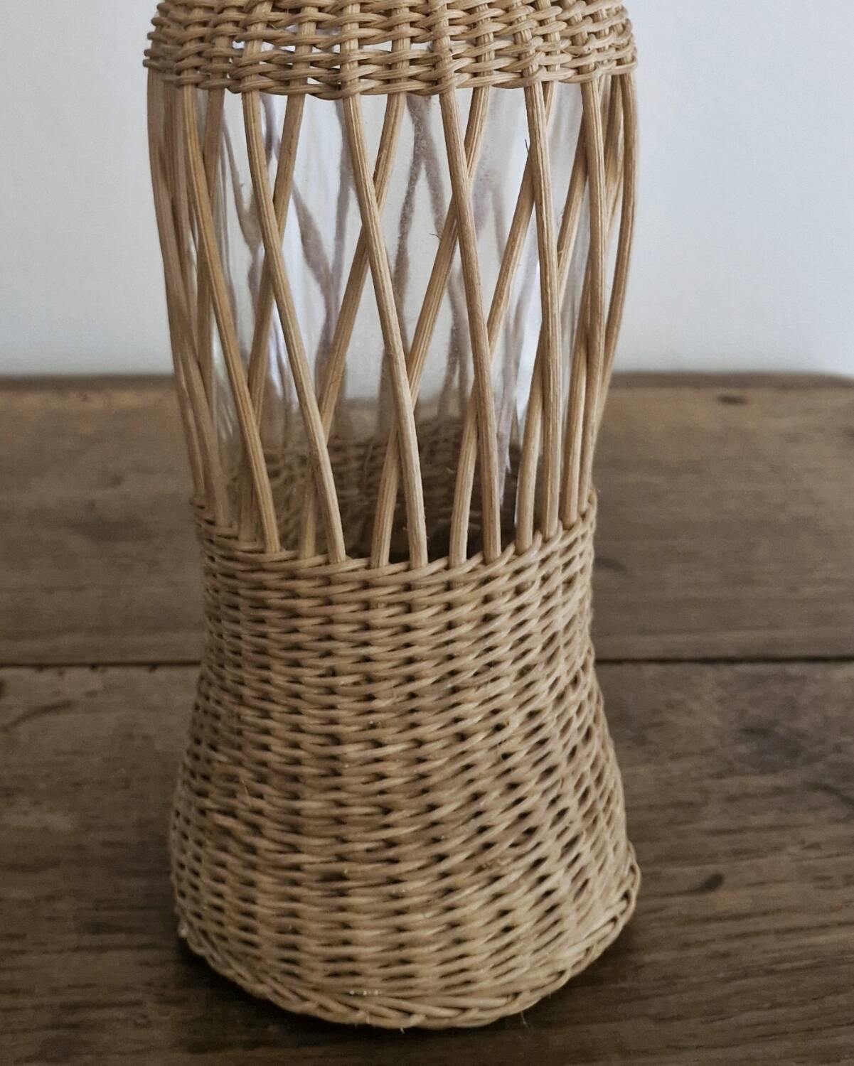 Glass and wicker bottle